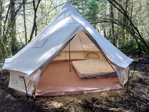 This is our 4+ person Bell tent with parking at your tent spot.