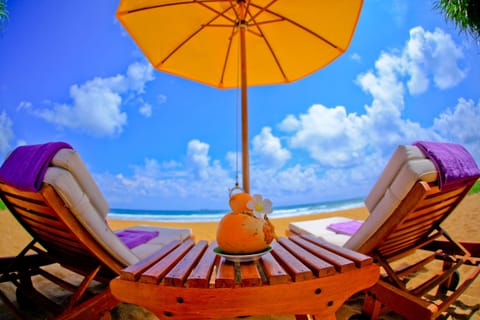 On the beach, sun loungers, beach towels