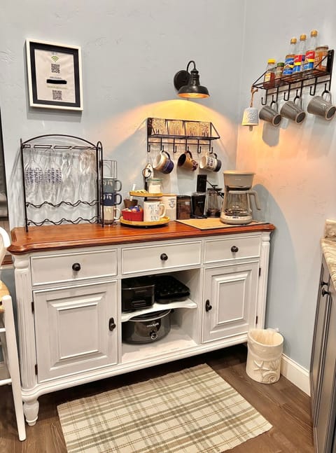 Stocked coffee bar. Ground and whole bean, syrups and coffee press.