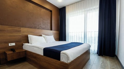 Family Room | Minibar, desk, laptop workspace, soundproofing