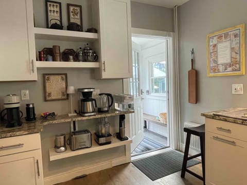 A mudroom off the back leads to the large wooden deck