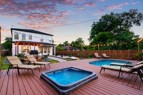 The stars of the backyard are the built-in deck pool and jacuzzi! 