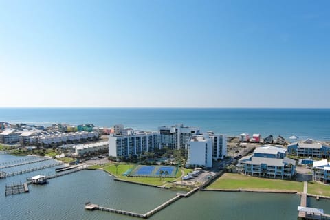 Paradise found: Experience private beach access and lagoon-side living at this premier Gulf Shores Surf and Racquet Club.