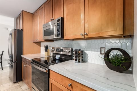 Kitchen with oven that has air fry capabilities and a freezer with an automatic ice maker