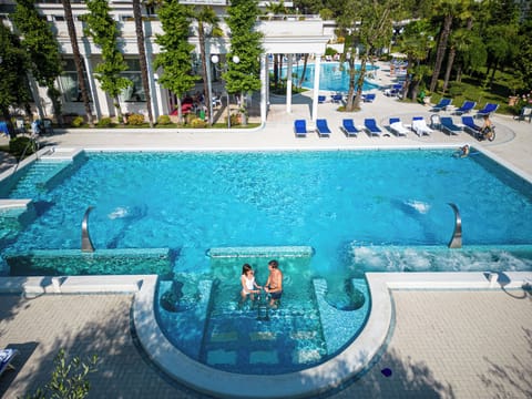 4 indoor pools, 2 outdoor pools, open 8:00 AM to 9:00 PM, pool umbrellas