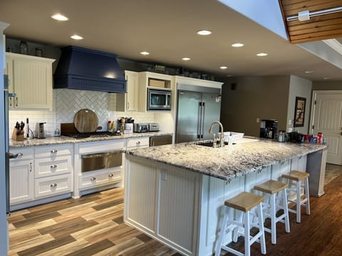 Kitchen Island, double fridge and freezer, microwave,and beverage refrigerator 