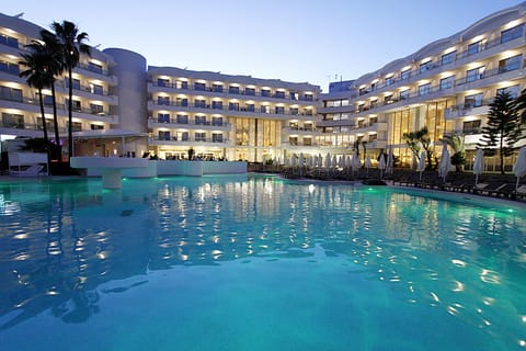 Indoor pool, outdoor pool, open 10:00 AM to 7:00 PM, pool umbrellas