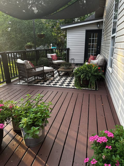 Summer view of the back yard with wrap around deck! You feel so secluded!