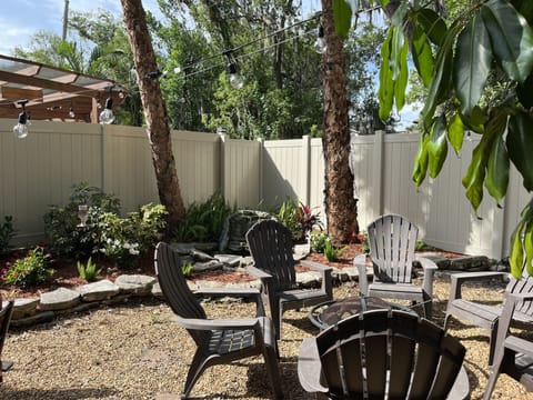 Backyard with fire pit and charcoal grill