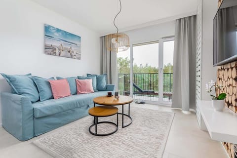 The living room is an ideal spot to relax after a long day. You can curl up on the comfortable sofa and watch your favorite movies on the flat-screen TV! 