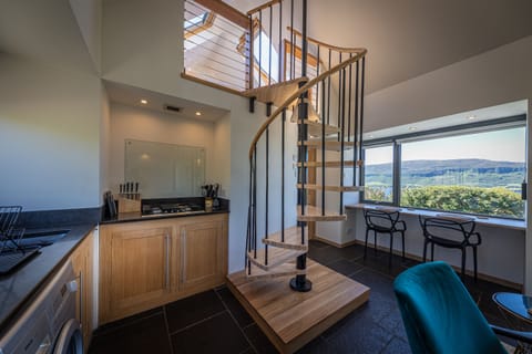 Spiral staircase to mezzanine level