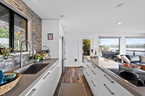 Open concept kitchen well stocked with kitchen essentials. 