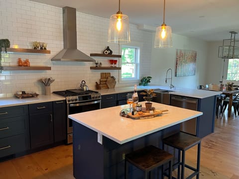 Have no FOMO while manning the stove because our open concept kitchen is adjacent to both the dining room and sitting room, so everyone has space to banter over charcuterie and a few glasses of crisp rosé.