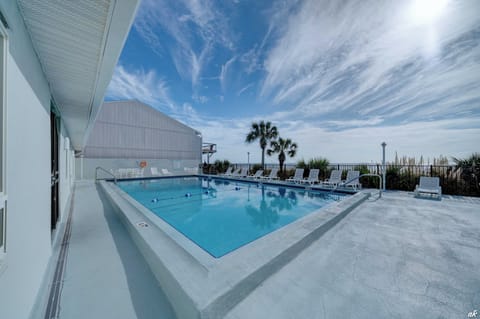 Just steps away from your balcony, enjoy access to the shared community pool, perfect for refreshing dips and leisurely lounging under the sun.