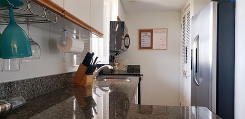 Updated kitchen with granite countertop and full sized washer and dryer. 