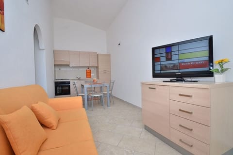 Family Condo, 2 Bedrooms, Private Pool, Garden View (Località Piricone) | Living area | LCD TV