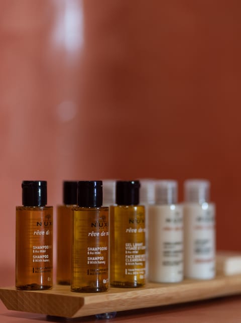 Shower, rainfall showerhead, designer toiletries, hair dryer