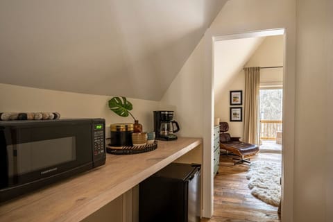 The loft suite has a mini microwave, mini fridge, and coffee maker