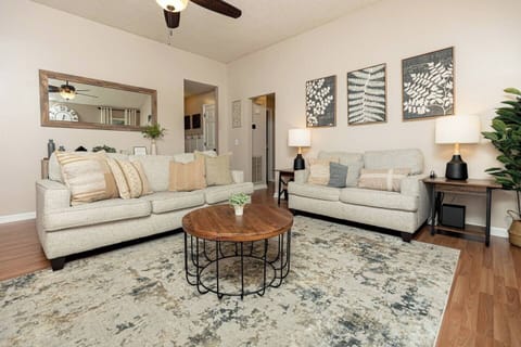 Living room w/ 75 in Smart TV [includes streaming capabilities]
