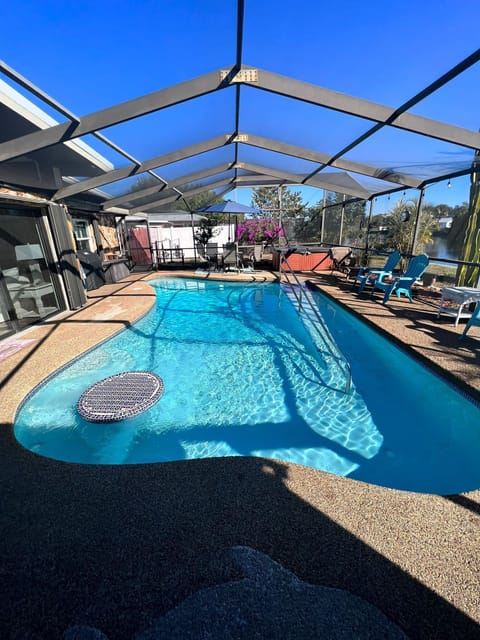 Screened Pool area with Hot Tub and Gas BBQ