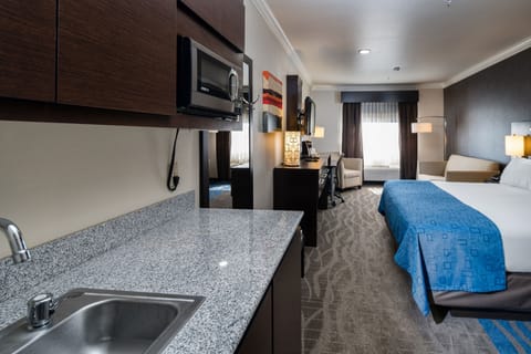 Suite, 1 King Bed | In-room safe, desk, iron/ironing board, rollaway beds