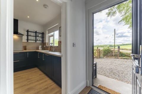 View from hallway to kitchen and driveway