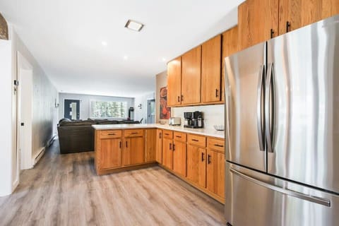 Fully equipped with an oven, stove, microwave, dishwasher and attached laundry and dining rooms, this lovely kitchen also provides nature views courtesy of the large window over the sink.