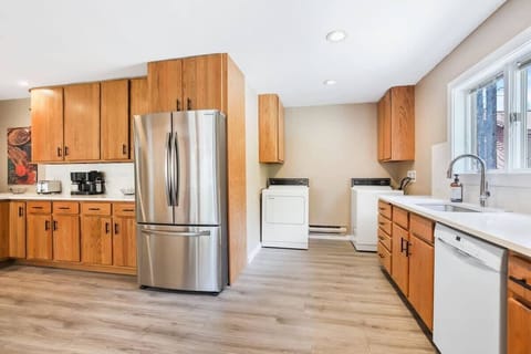 The laundry area is made up of a washer and dryer and is situated just adjacent to the kitchen, straight from the entrance to the home.