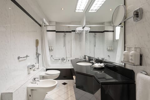 Suite, 1 Bedroom, Smoking (1 King Bed) | Bathroom | Bathtub, free toiletries, hair dryer, slippers