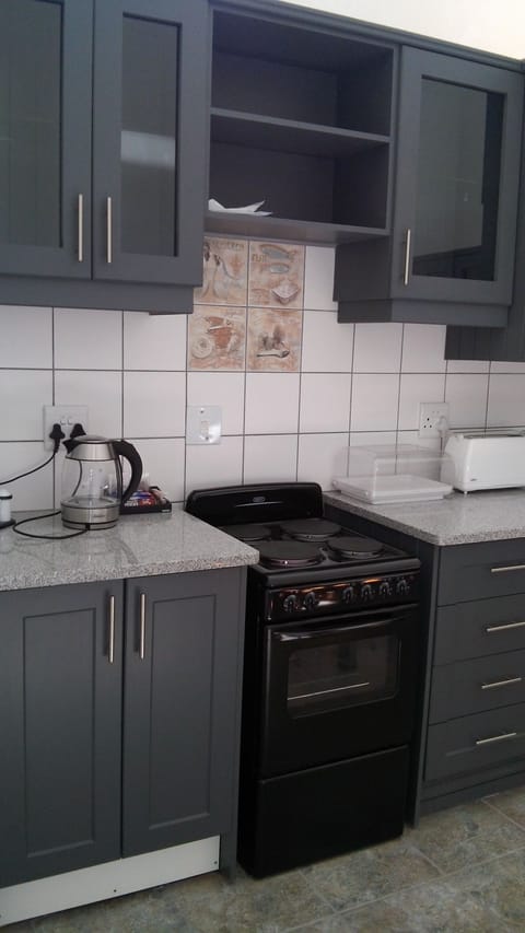 Deluxe Room Self Catering | Private kitchen | Fridge, microwave, coffee/tea maker, electric kettle