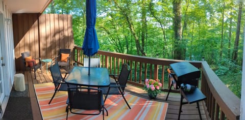 upgraded back patio with a blackstone grill and firepit

