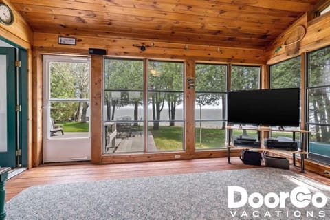 Sun-filled lakefront lounge with panoramic Lake Michigan views — perfect for coffee, books, or movie nights