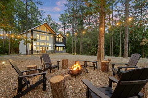 Welcome to Range Life - your modern luxury escape nestled in the pines of Broken Bow!