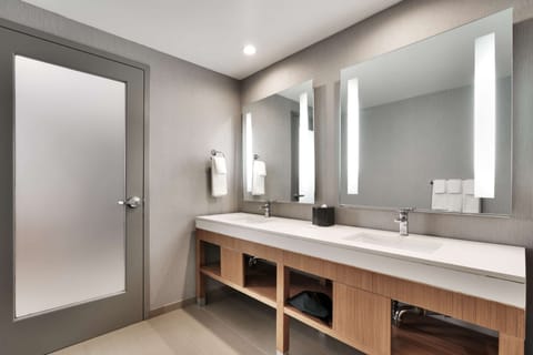 Designer toiletries, hair dryer, towels