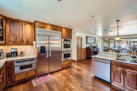 Huge kitchen with two Bosch dishwashers and large dining room