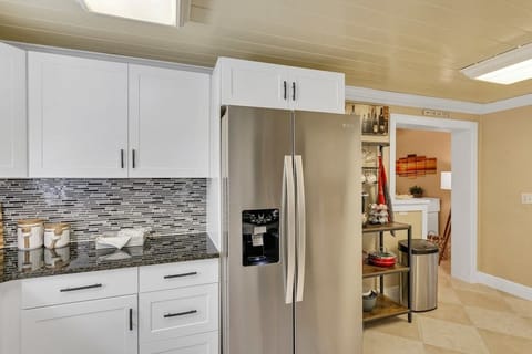 Beautifully clean & spacious kitchen with all new appliances! Stocked with everything you need for your stay & then some! Pots, pans, utensils, plates, bowls, wine glasses, coffee mugs, cups, blender, toaster, Keurig Duo k-cup & coffee maker & more!