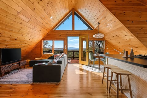 A private mountain retreat with panoramic Blue Ridge views. Close enough for an easy trip into town, yet tucked away in nature. 