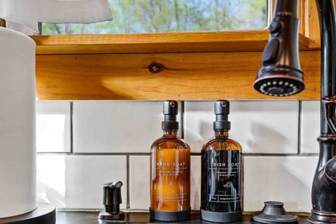 Gentle hand soap and dish soap by the double kitchen sink.