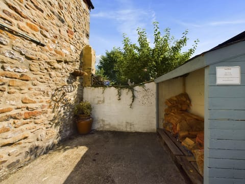 Back yard (enclosed), with log store to buy wood from.