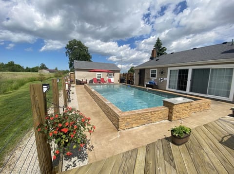 The Pool and "Dry Dock".  Your in ground pool, tanning area + Patio and Grill !