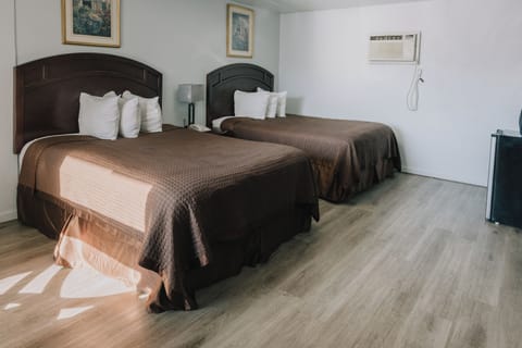 Standard Room, 2 Queen Beds | Desk, iron/ironing board, free cribs/infant beds, free WiFi
