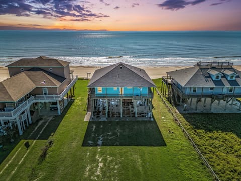 Relax in this spacious 3-bedroom beachfront home, offering stunning views of the Gulf of Mexico. Perfect for families and large groups, with easy access to the sand and sea just steps away!