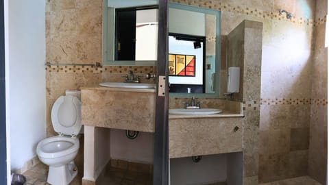 Standard room with fan | Bathroom | Shower, towels, soap, shampoo