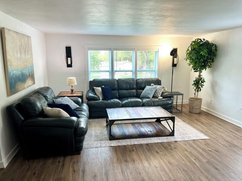 Comfortable and spacious living room with a couch and loveseat