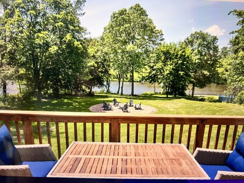 Your private deck overlooking the riverfront 1 acre property and 2  firepits
