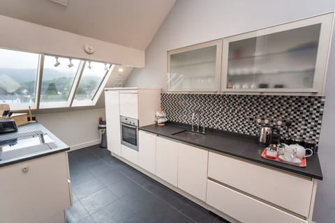 You can enjoy incredible panoramic views towards Skiddaw and Latrigg from the third floor kitchen