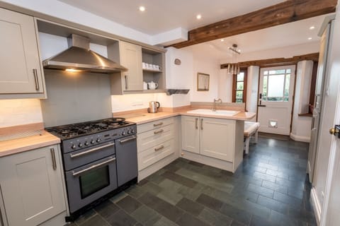 A lovely spacious kitchen and dining area with access to the rear patio and parking spaces