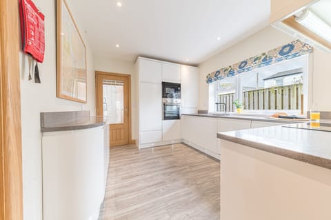 From the dining room you enter the spacious kitchen