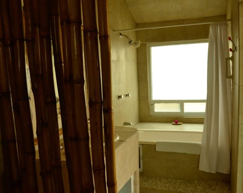 Junior Suite, 2 Queen Beds | Bathroom | Combined shower/tub, hair dryer, towels, soap