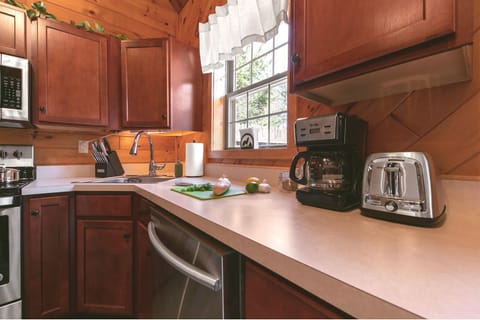 The kitchen is a perfect combination of cozy and convenient